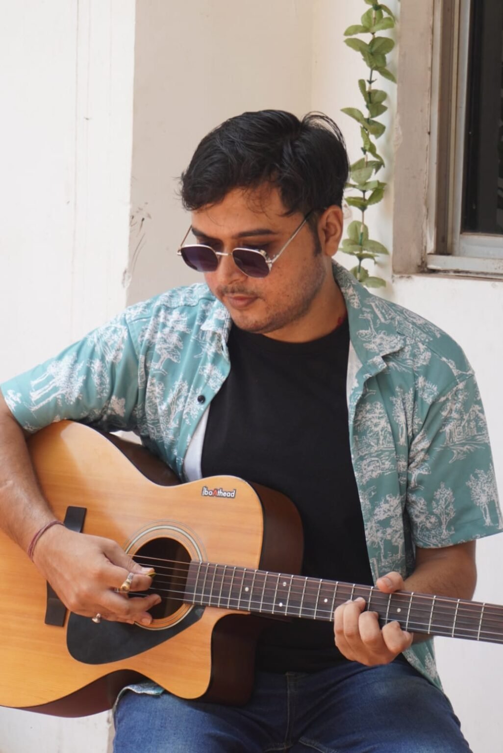 Student playing guitar